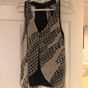 Sleeveless top with sheer over drape